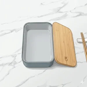 Traditional Japanese handcrafted wooden bento box empty showing natural grain texture and internal dividers.