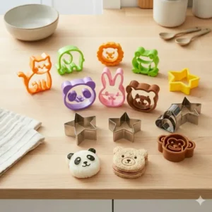 A variety of animal-shaped bento box cutters including bears, rabbits, and stars for kids' lunches.